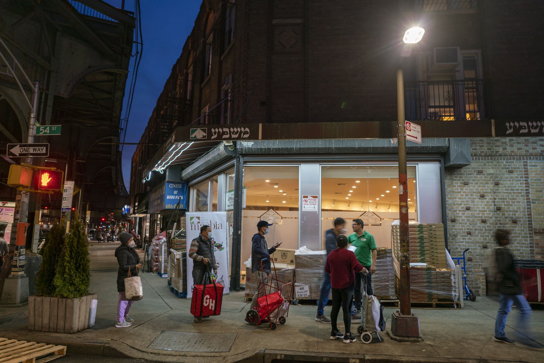 Clients line up outside of Masbia well into the evening. At the height of the pandemic the pantry operated 24 hours a day. Now doors open at 9AM and close at midnight.