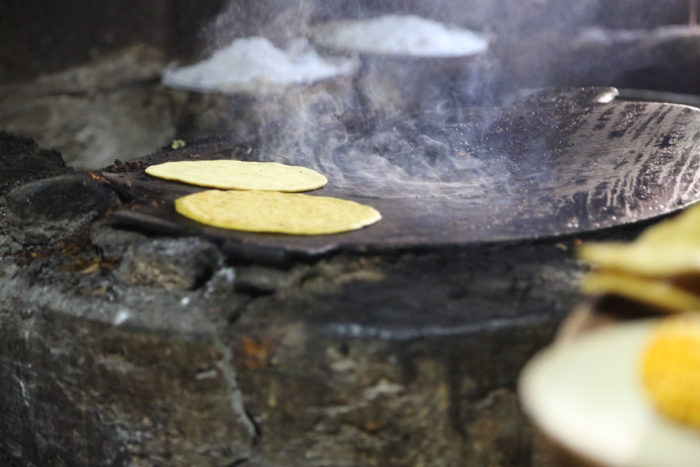 Antonia Chulim Noh’s handmade tortillas on her comal in Kahua, Yucatán. (Photo credit: Venetia Thompson)