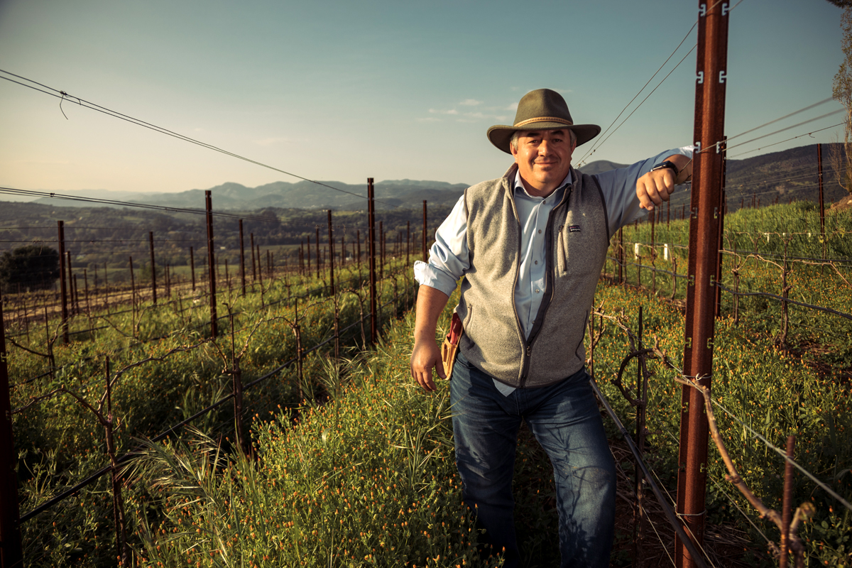 Rolando Herrera standing in the fields. (Photo credit: Rocco Ceselin)