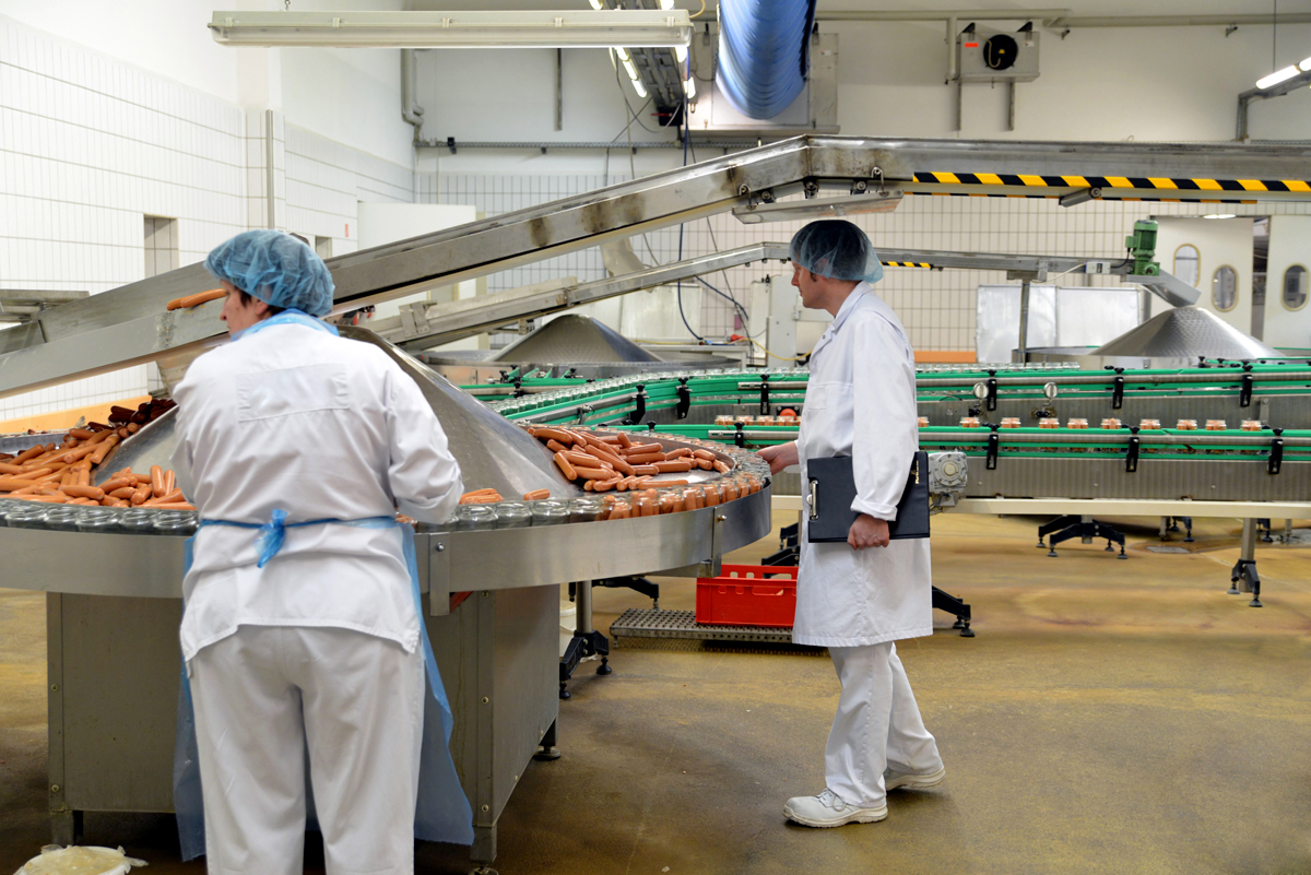 Food safety inspection at a meat processing facility.