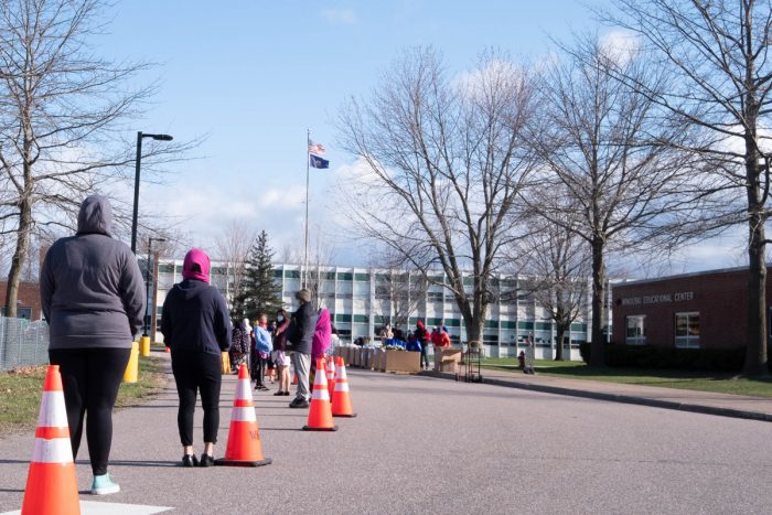 A long line of people waiting to get food from local farms and others at the Vermont Food Bank. Photo courtesy of the Vermont Food Bank.