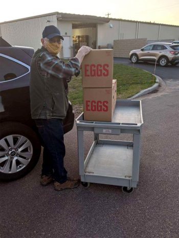 Bob Braun of Pigeon River Farm donates eggs to the Interfaith Food Pantry in Wisconsin. (Photo courtesy of Pigeon River Farm)