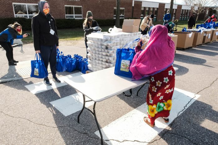 A long line of people waiting to get food from local farms and others at the Vermont Food Bank. Photo courtesy of the Vermont Food Bank.