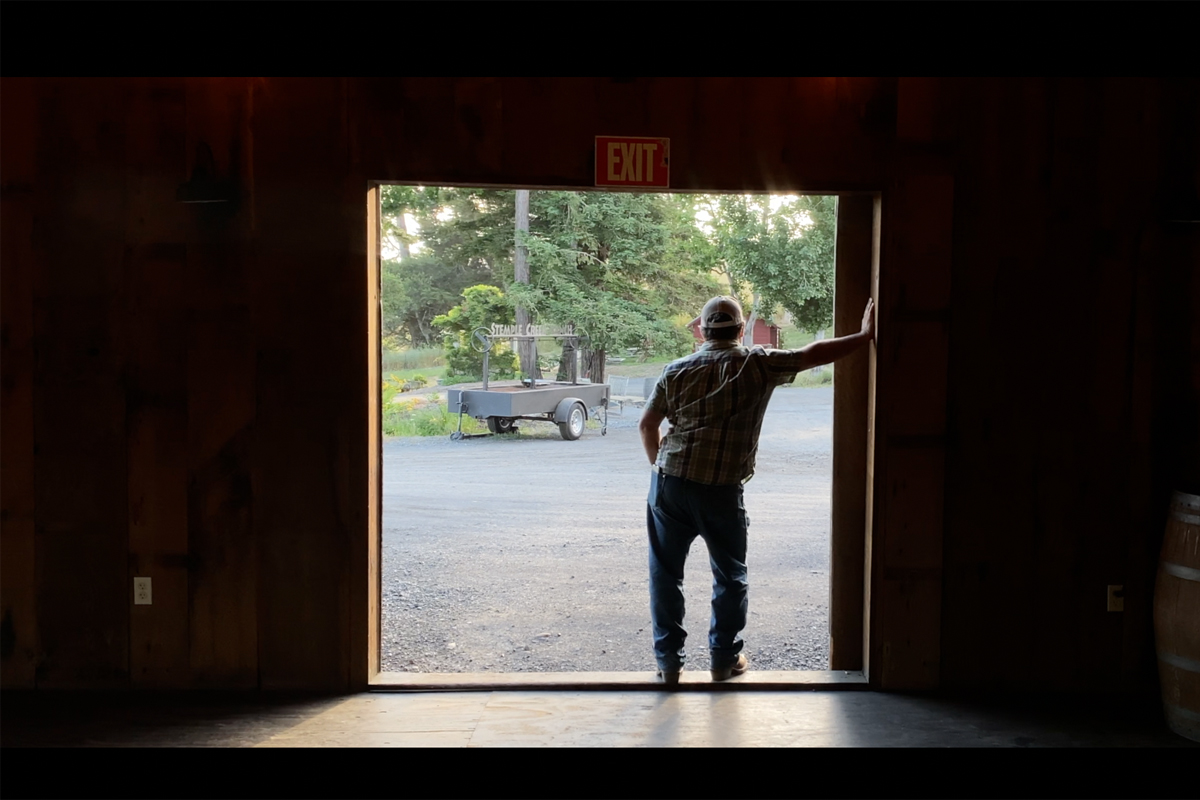 loren poncia stands in the doorway of his barn