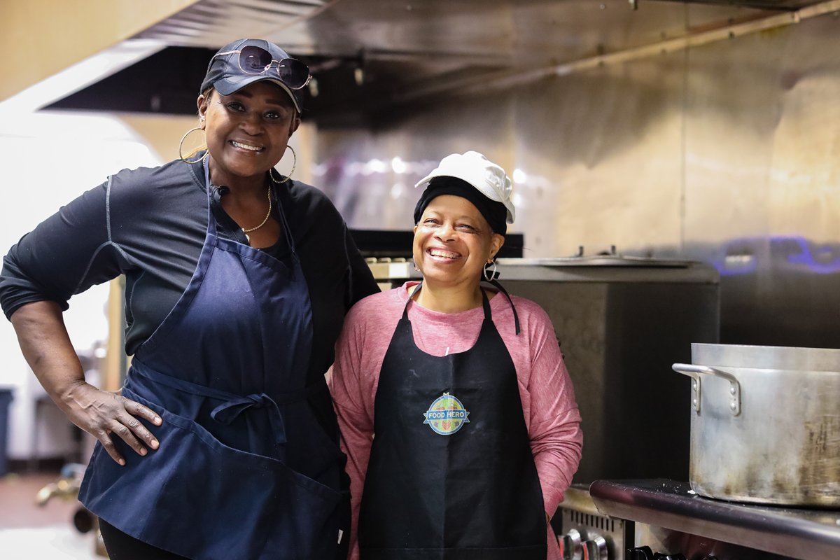 Two of the Grandma's Hands chefs posing in the kitchen. (Photo credit: Robin Franzen Parker)