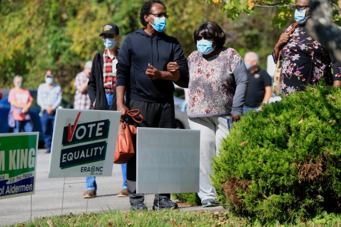 Voters wait in line to vote at a polling place in Black Mountain, North Carolina. Record numbers came out for the first day of early voting in North Carolina. (Photo by Brian Blanco/Getty Images)