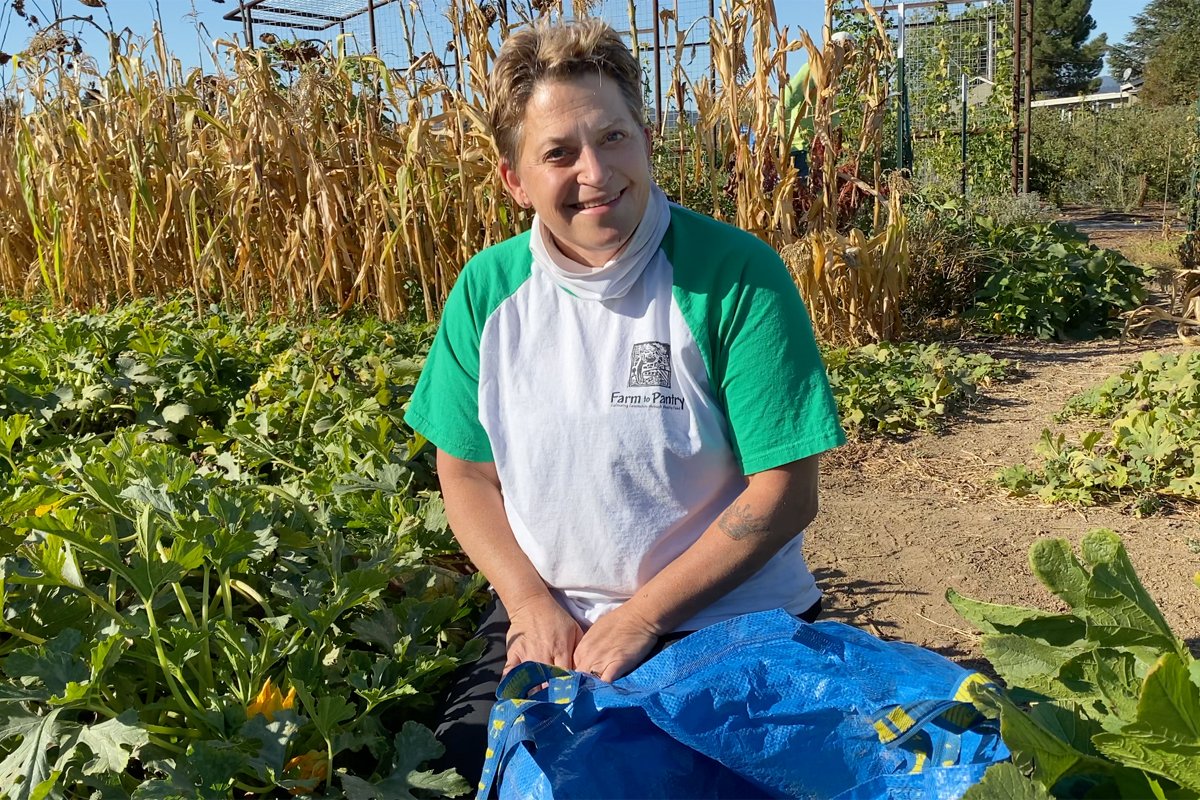 Duskie Estes pauses while gleaning for a photo.