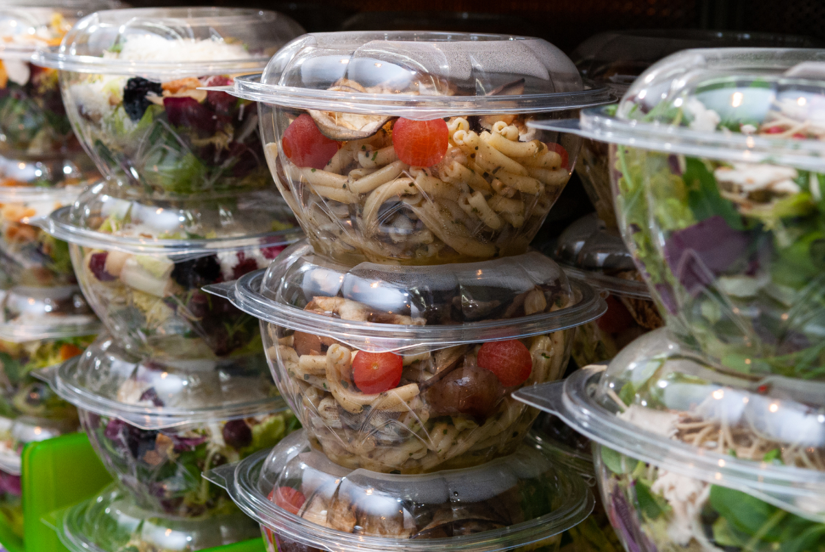 A closeup shot of tasty food in plastic containers in the shop