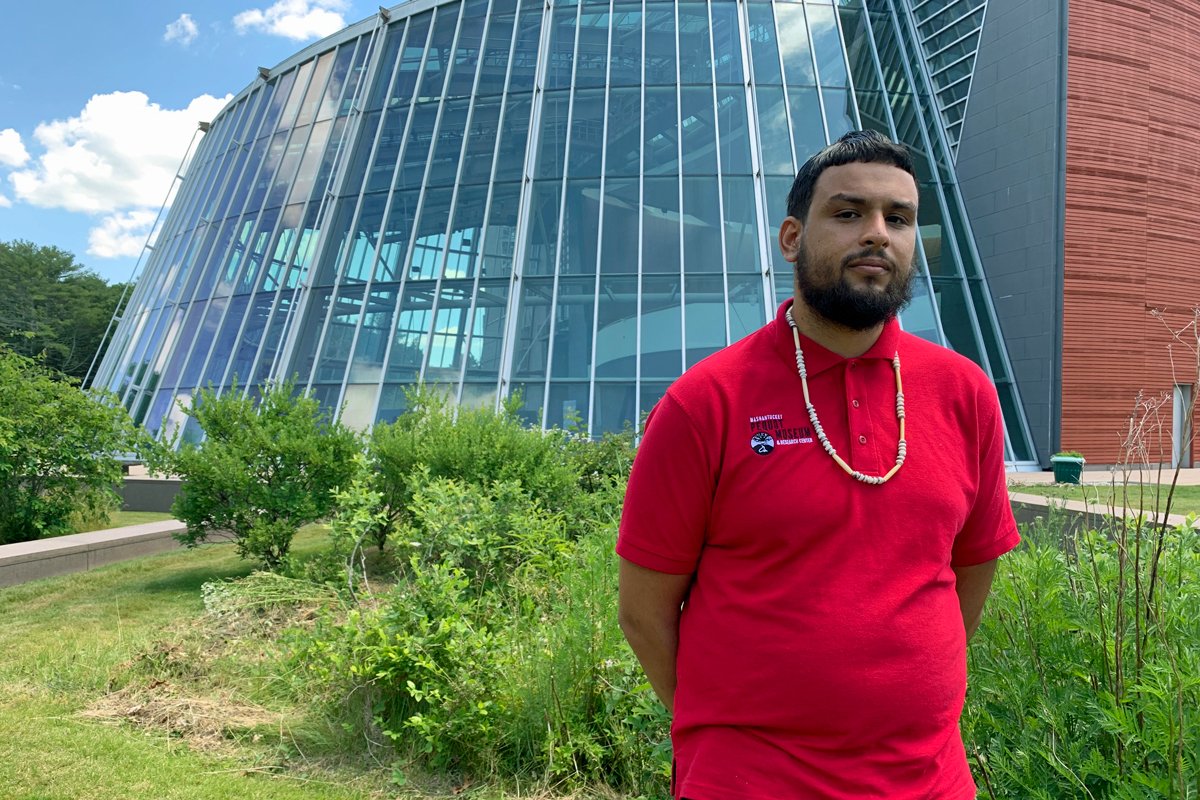 Nakai Clearwater Northup stands behind three traditional ethnobotany gardens, which he manages at the Mashantucket Pequot Museum & Research Center. At one time, his people solely relied on them to maintain their cultural connections to food before the founding of Meechooôk Farm. (Photo by Gabriel Pietrorazio)