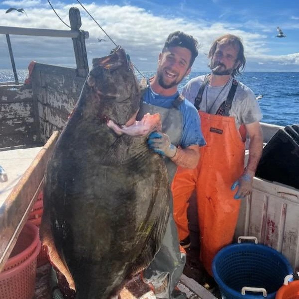 Lucas Raymond holding a halibut. (Photo courtesy of the New England Young Fishermen's Alliance)