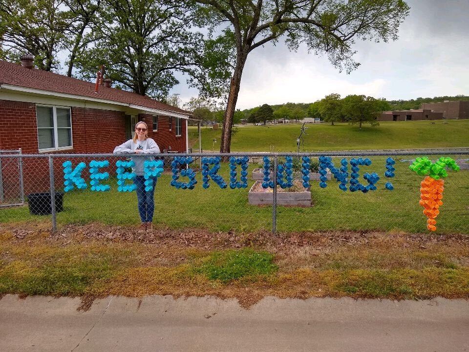 tara mcdaniel stands outside cedarville elementary school garden. Photo courtesy of Food Corps